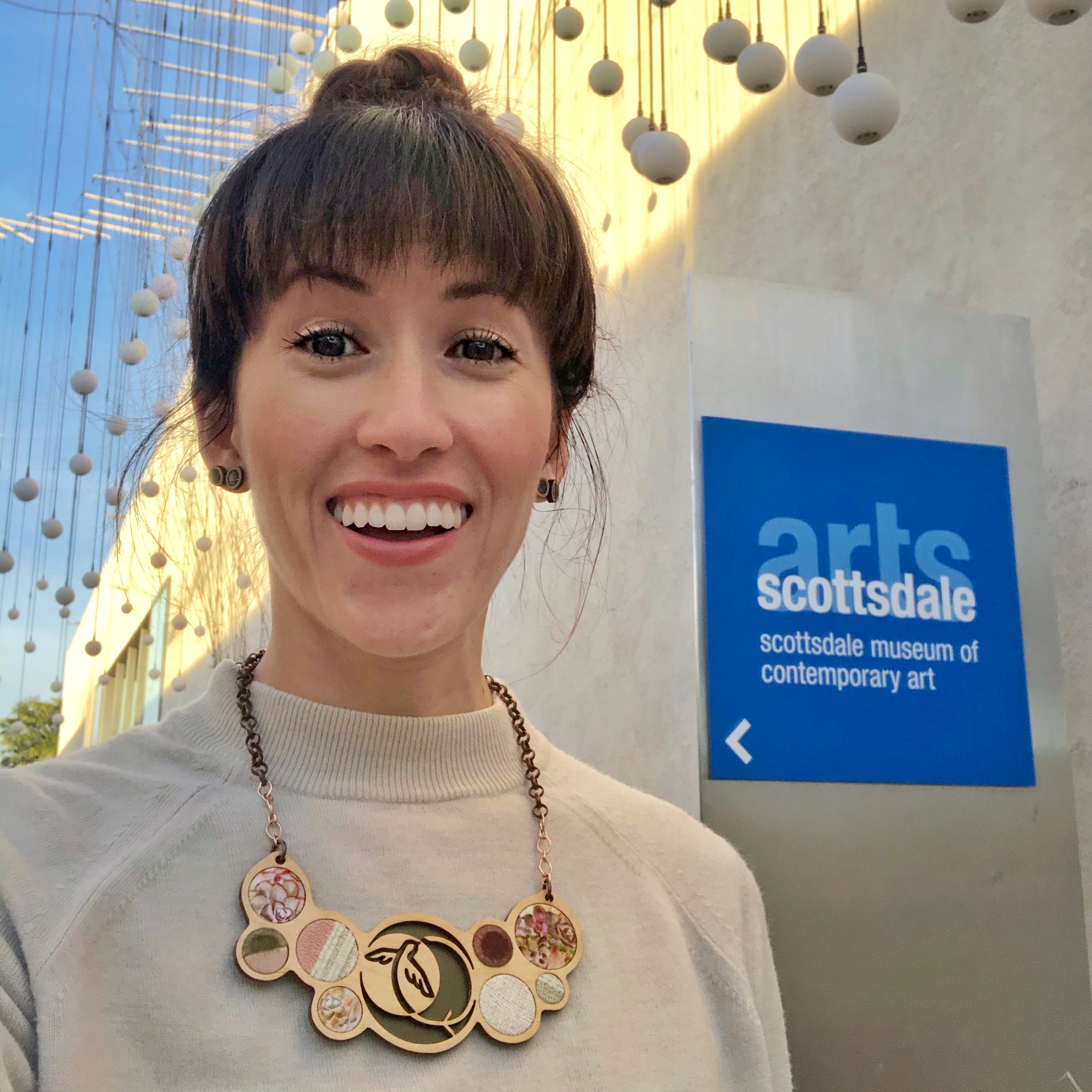 Alyssa Bird in front of the Scottdale Museum of Contemporary Arts