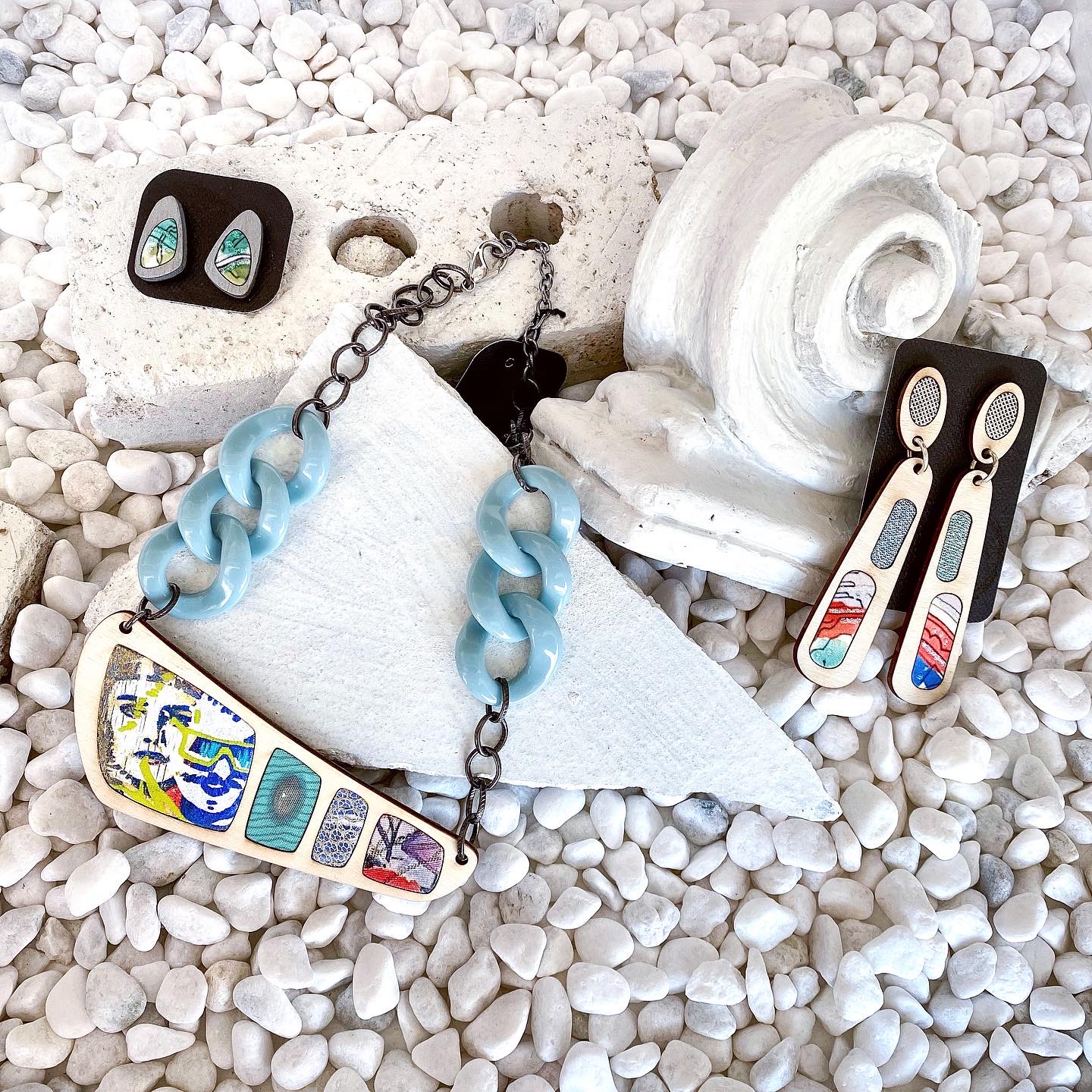 Regenerous Designs, Positive Perspective art jewelry collection for the Art Collective Gallery. 2 earrings and a necklace