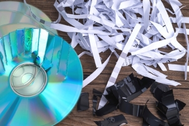 Data Destruction - Shredded paper and broken CDs