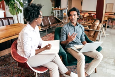 Man having a conversation with a woman