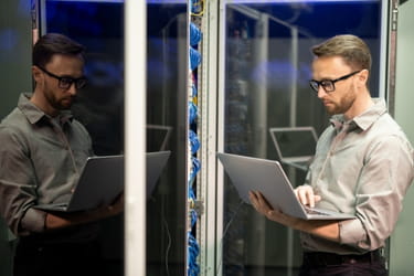 IT Manager working on his laptop