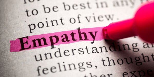 The word 'empathy' being highlighted in a dictionary.
