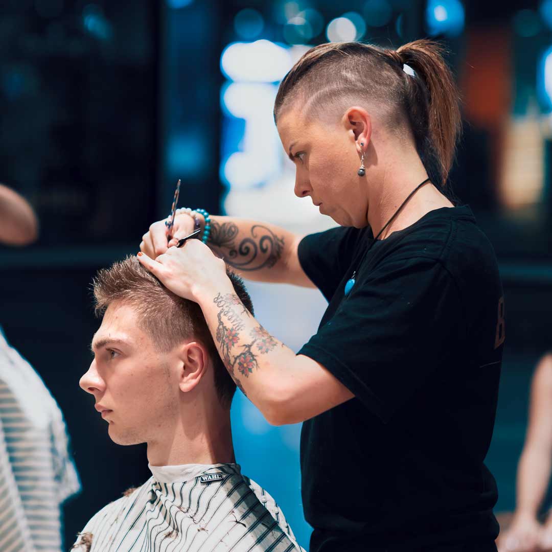 Female Barber Cutting Hair