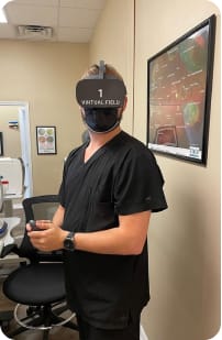 Ophthalmologist wearing virtual reality headset.
