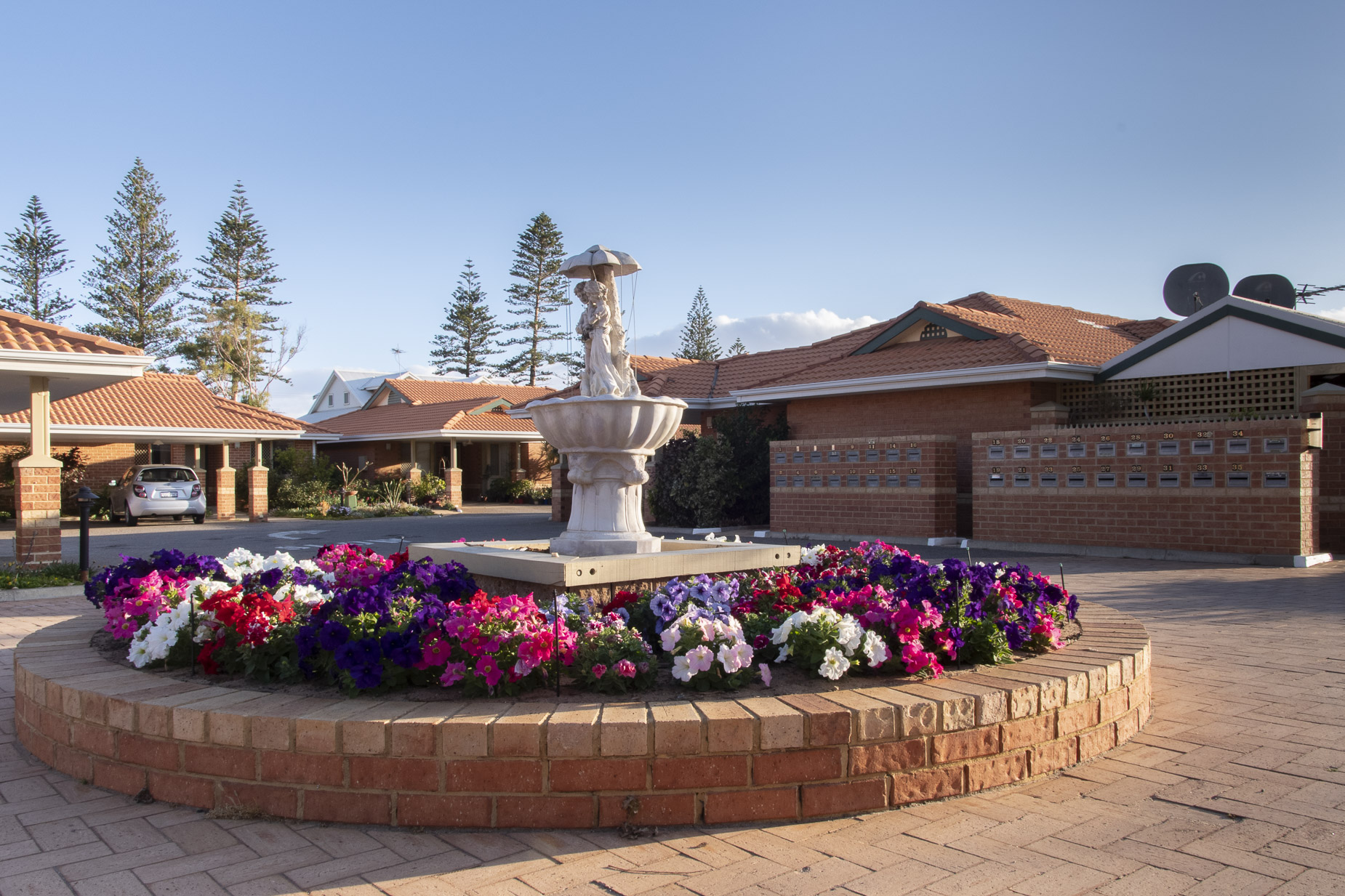 a retirement villa with flowers in the garden