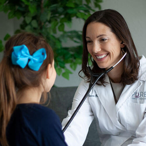 Dr Rebecca Bub caring for a pediatric patient