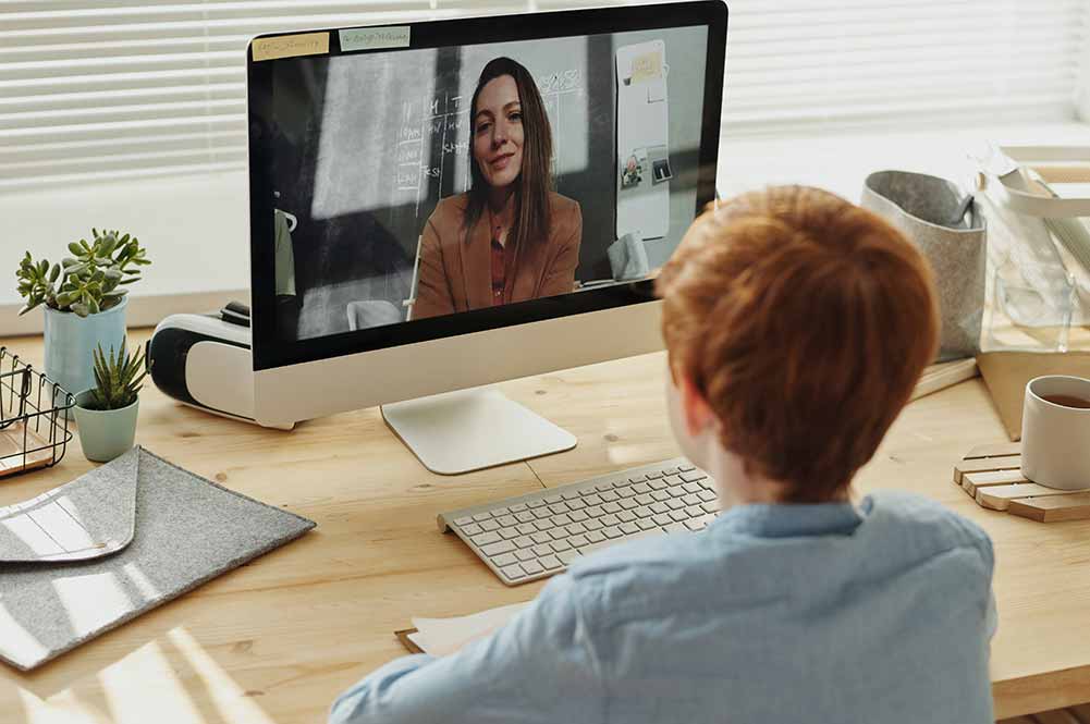 Remote learning school child talking to teacher
