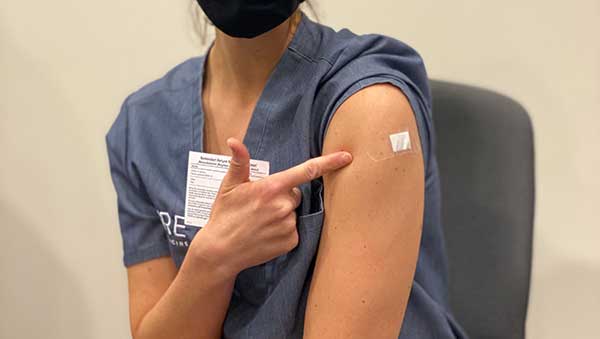 Dr. Rebecca Bub getting the COVID-19 vaccine