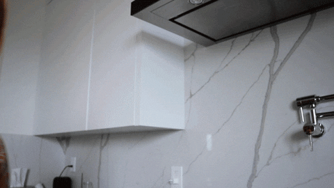 GIF of a woman slowly entering the screen from the left saying "What about now?"