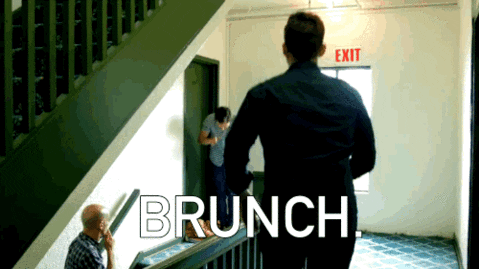GIF of three peoplestanding in a hallway bending down and standing up with their hands raised saying "Brunch"