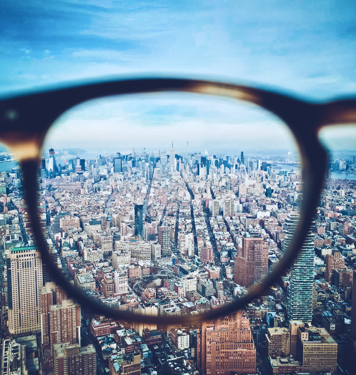 Eyeglasses looking through to city