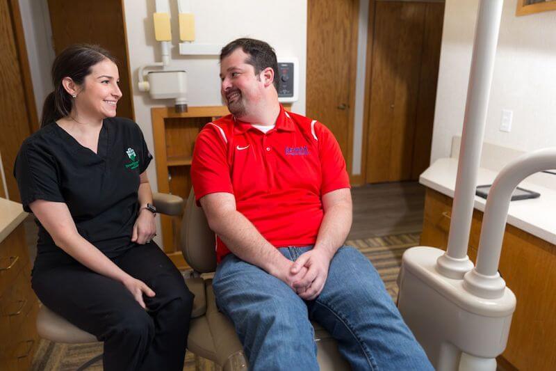 Dental Assistant smiling with patient