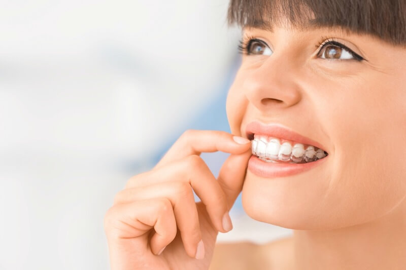 young girl smiling with invisalign