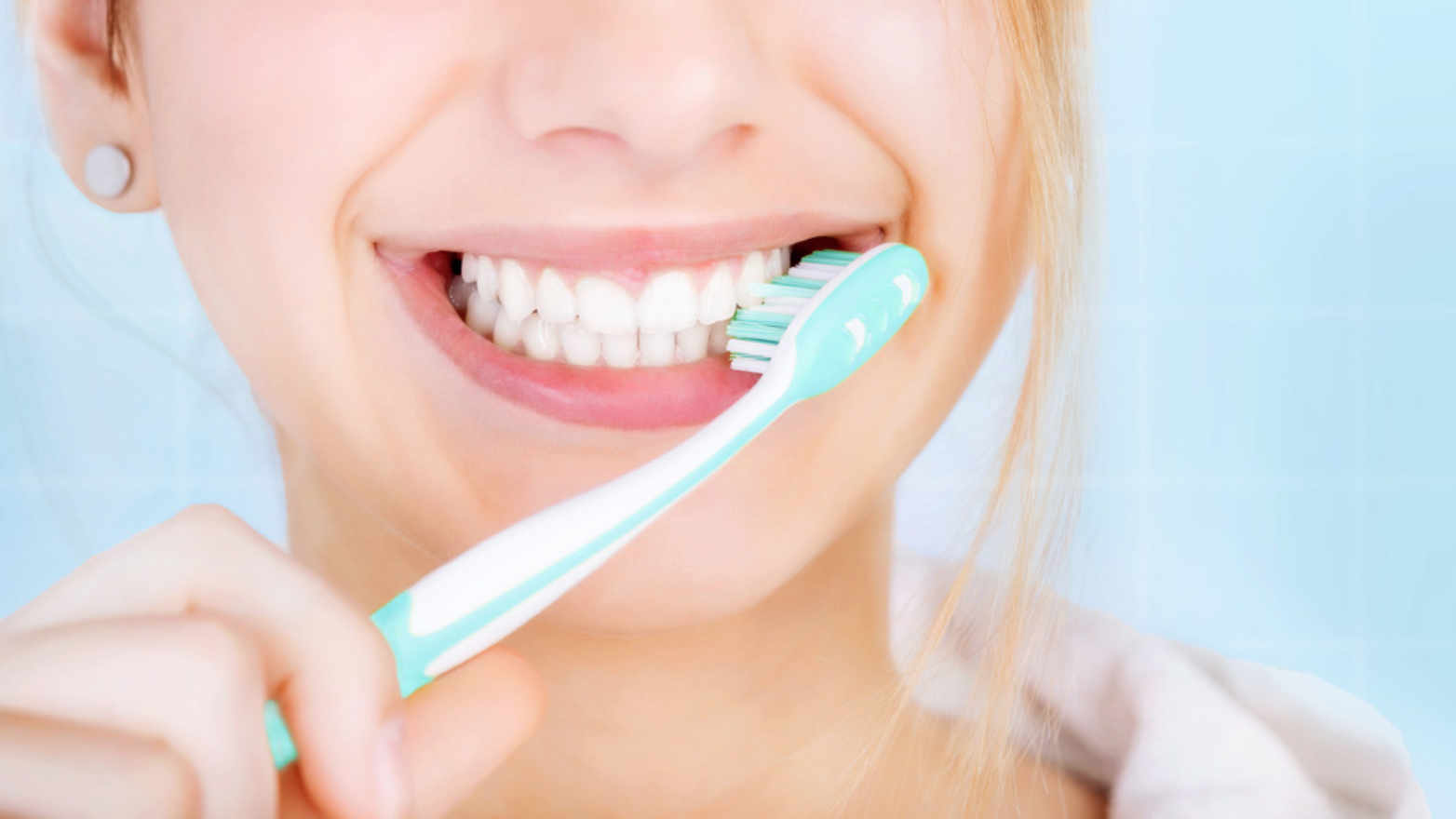 Closeup of girl brushing her teeth