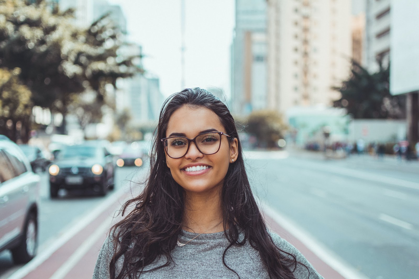 woman wearing black eye glasses smiling