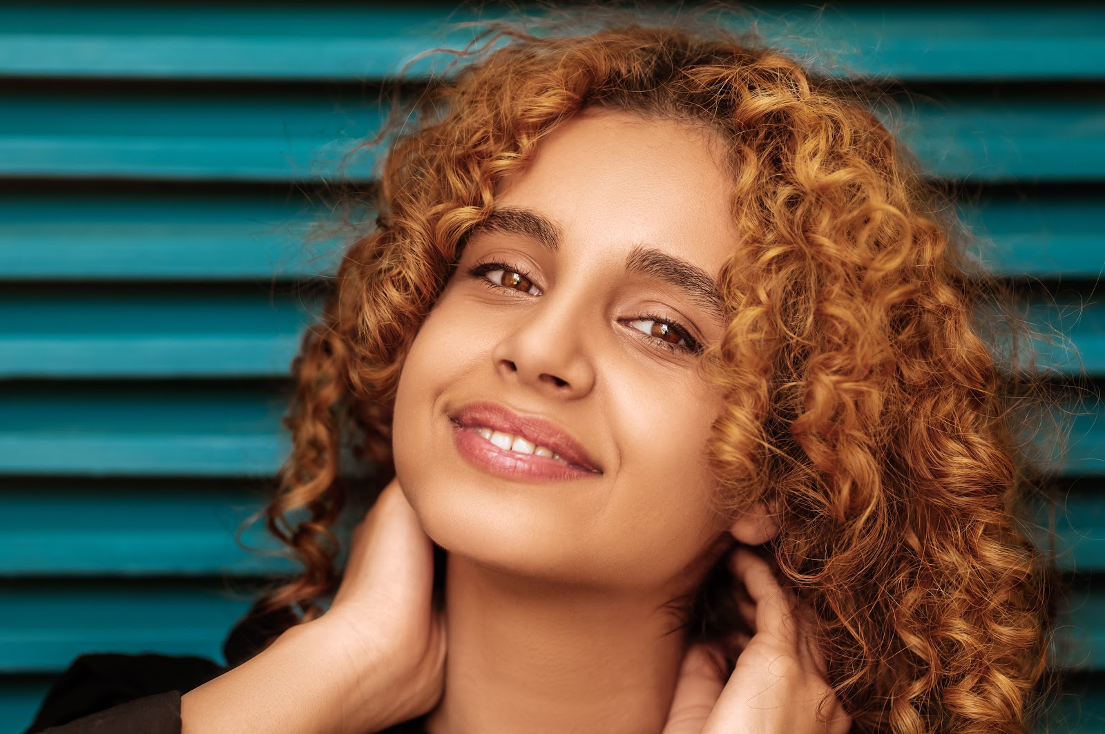 Woman with curly hair smiling