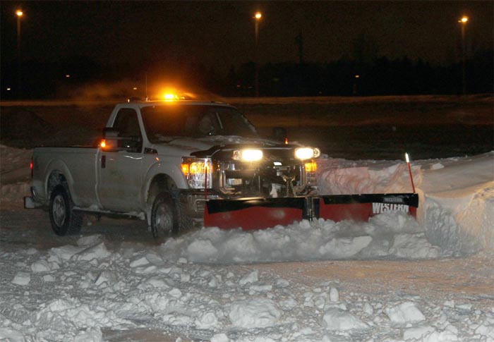 Pickup truck with snow clearing attachment