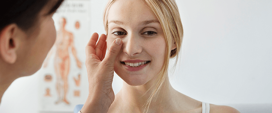 Doctor examining face post-Moh's Reconstruction