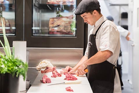 Peter Bouchier butcher chopping beef