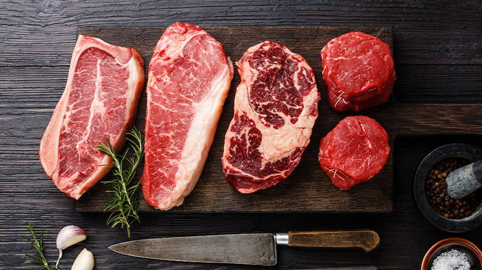 Variety of Angus Prime meat steaks, including Blade on bone, Striploin, Rib eye, and Tenderloin fillet