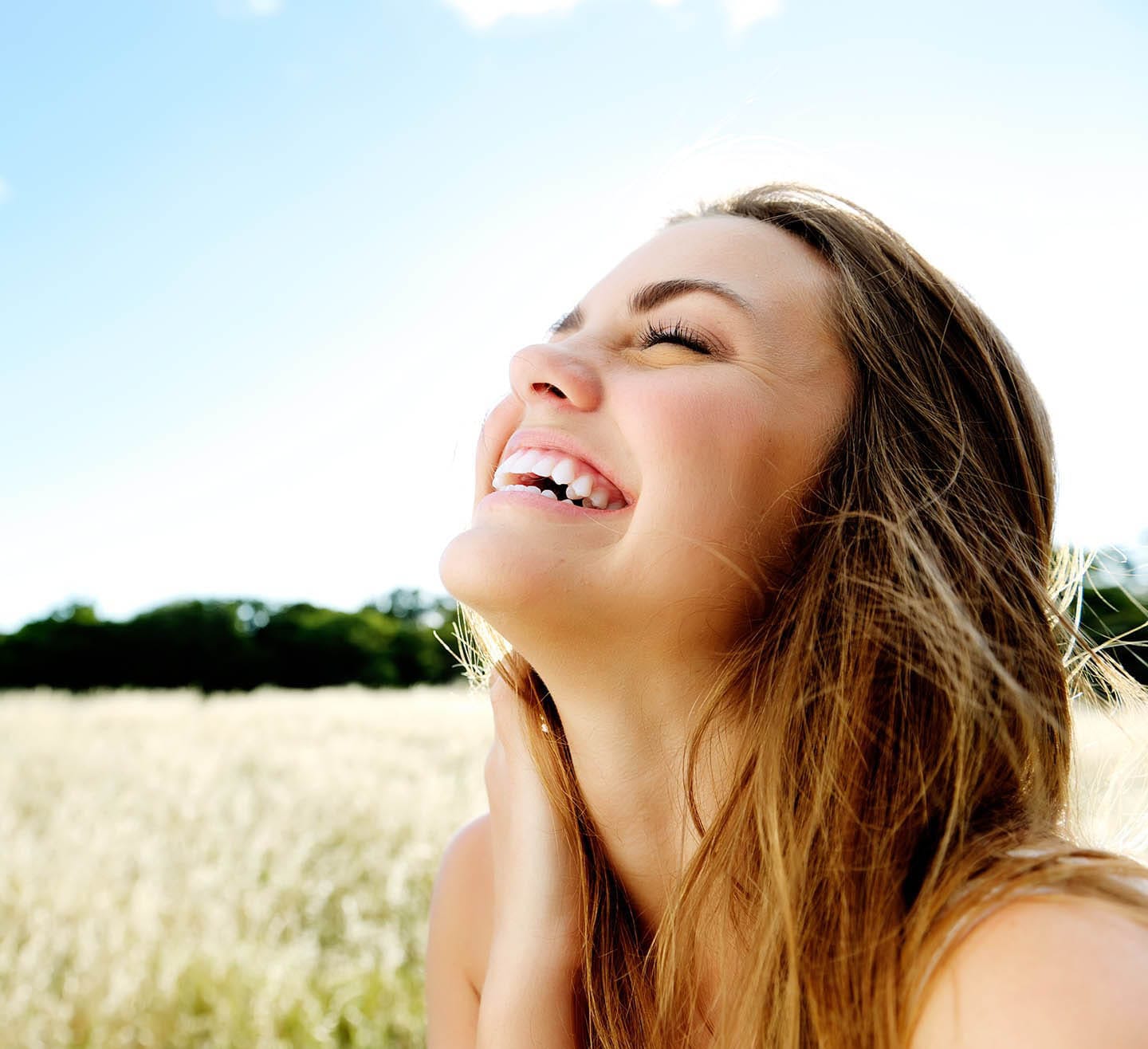 smiling woman in field