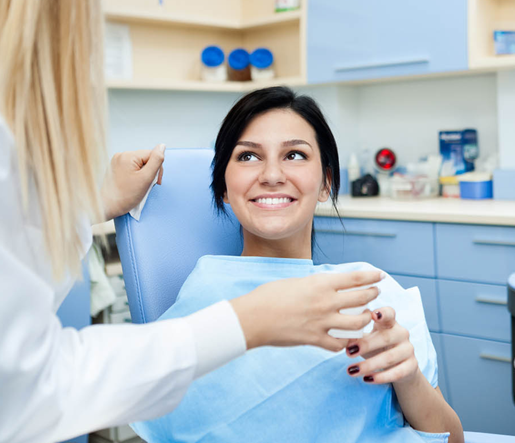 dental patient smiling at doctor