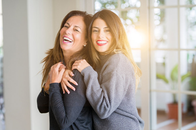 mother and daughter hugging
