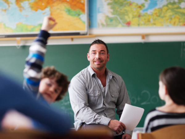teacher collaborating with students