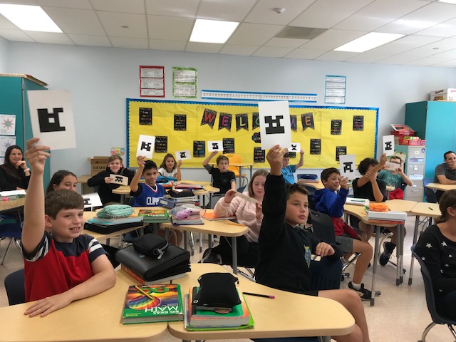 students participating in the classroom