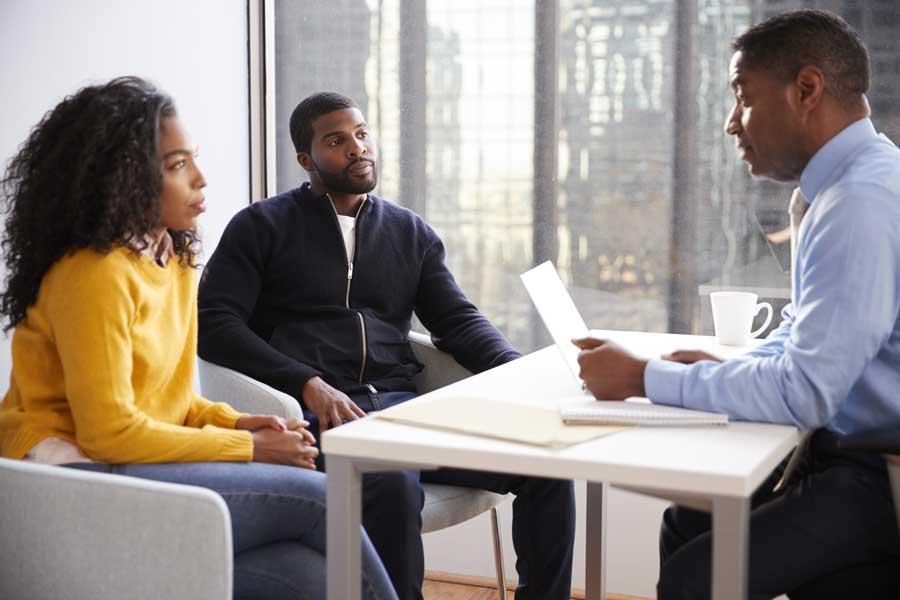 couple meeting with attorney