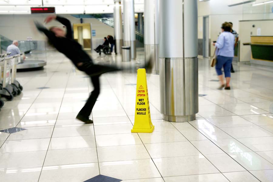 person slipping on wet floor