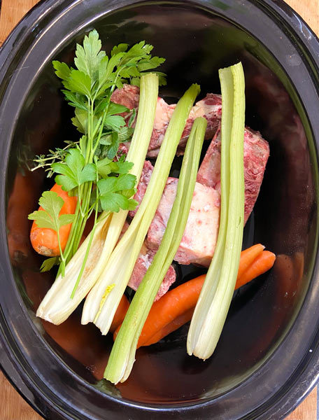 vegetabls and bones in slow cooker