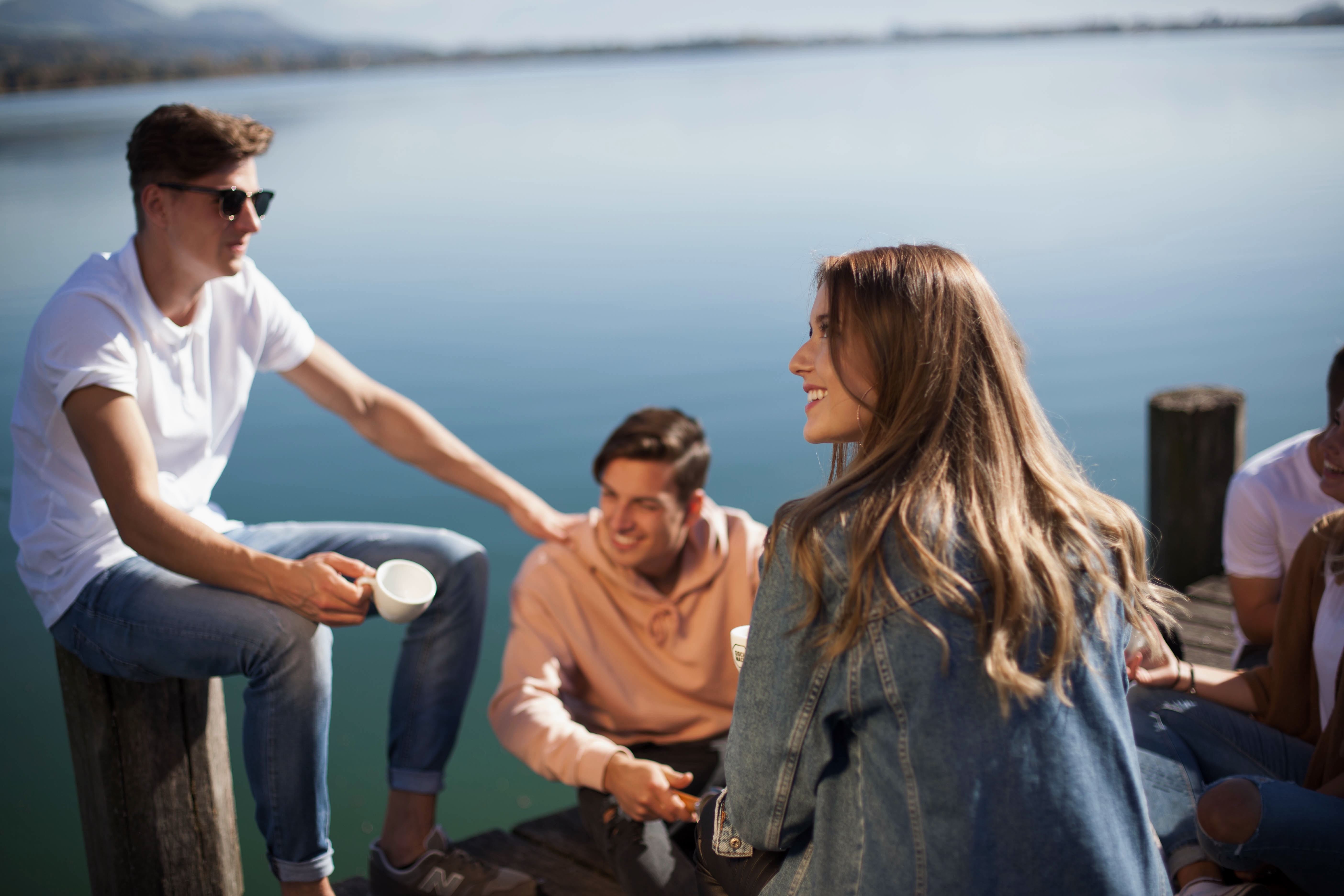 Top loyalty solutions - title slide (people sitting on the dock)