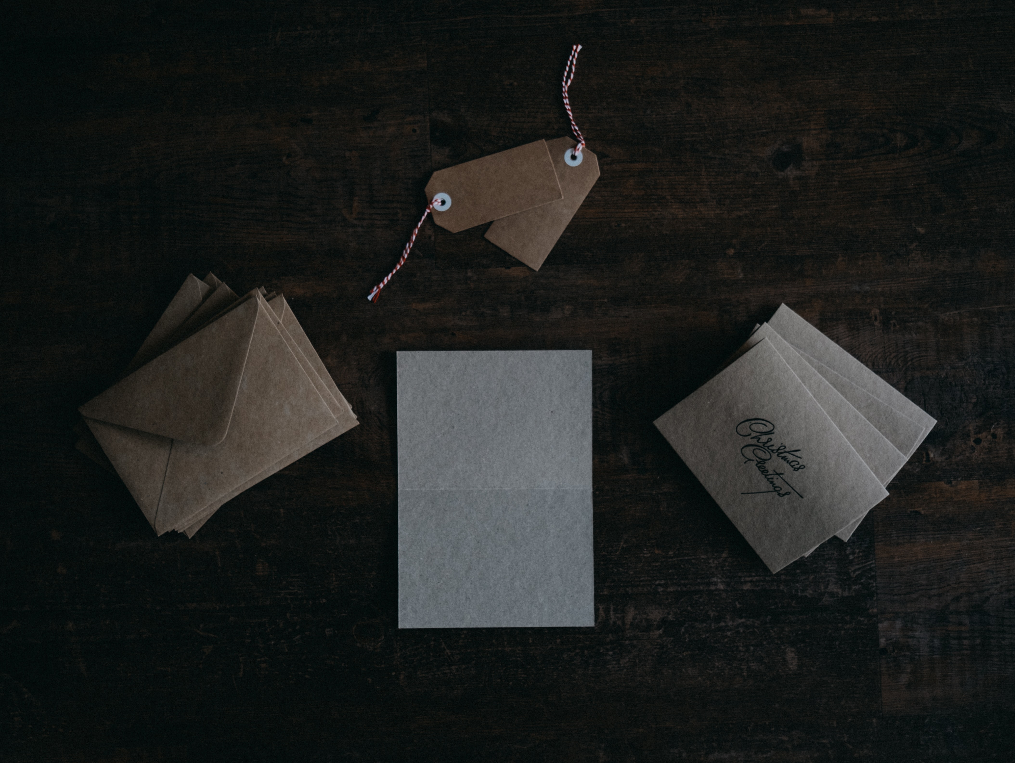 The features of gift cards management software title image, brown envelopes and cards