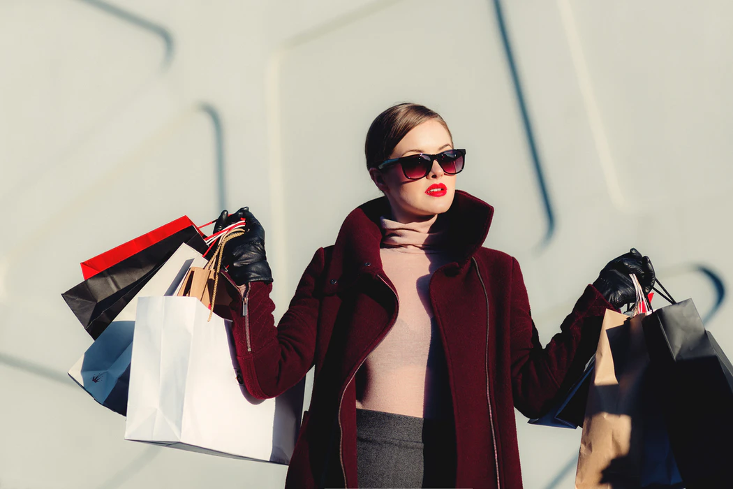 Woman with shopping bags – cons of loyalty programs