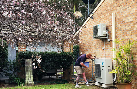 A worker with an outdoor air conditioning system