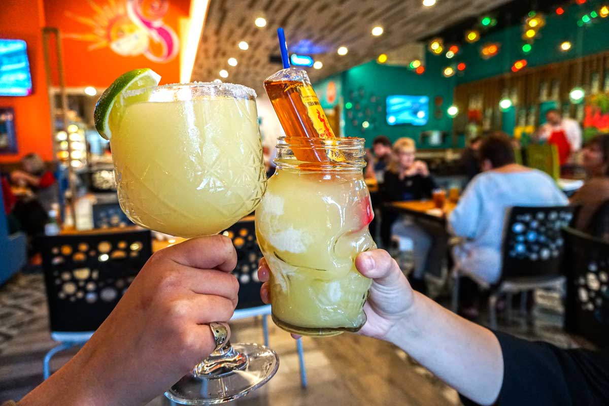 margarita in a glass with jalapeno and lime