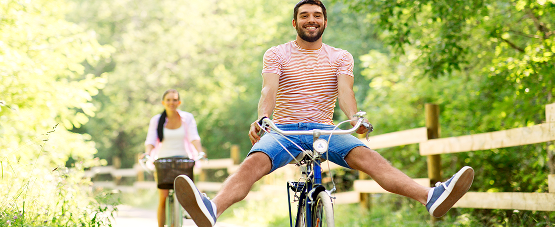 Couple on bikes feeling better and breathing well.