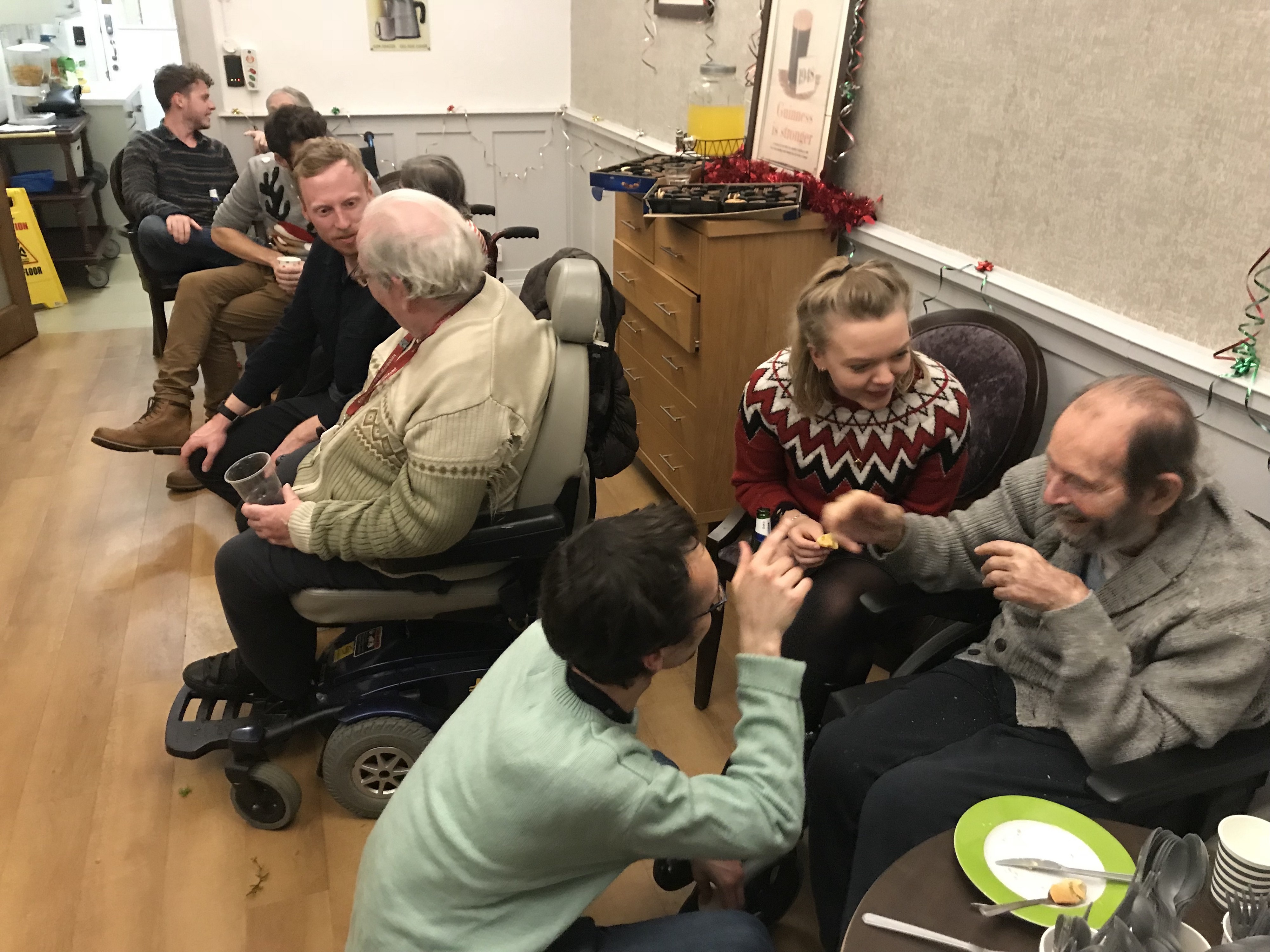 the birdie team volunteering in a care home to help older adults