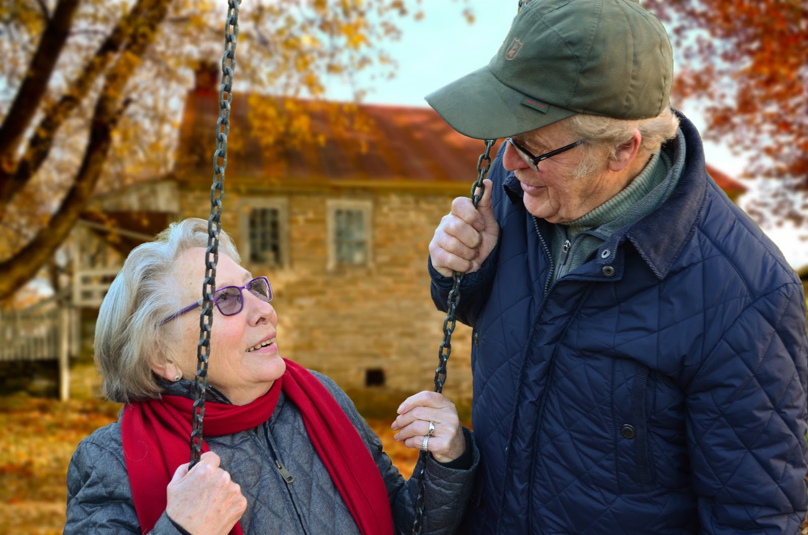 elderly couple on swing