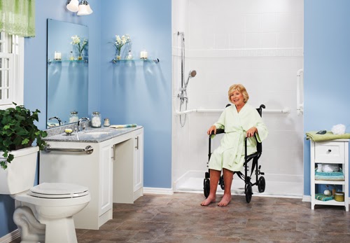 elderly woman in wheelchair by accessible shower