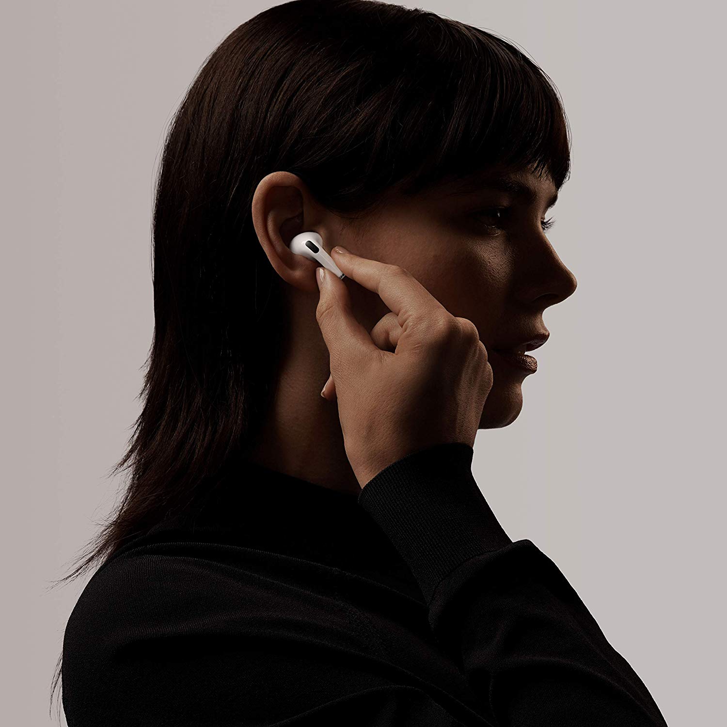 A woman putting in the new Apple Airpod Pros