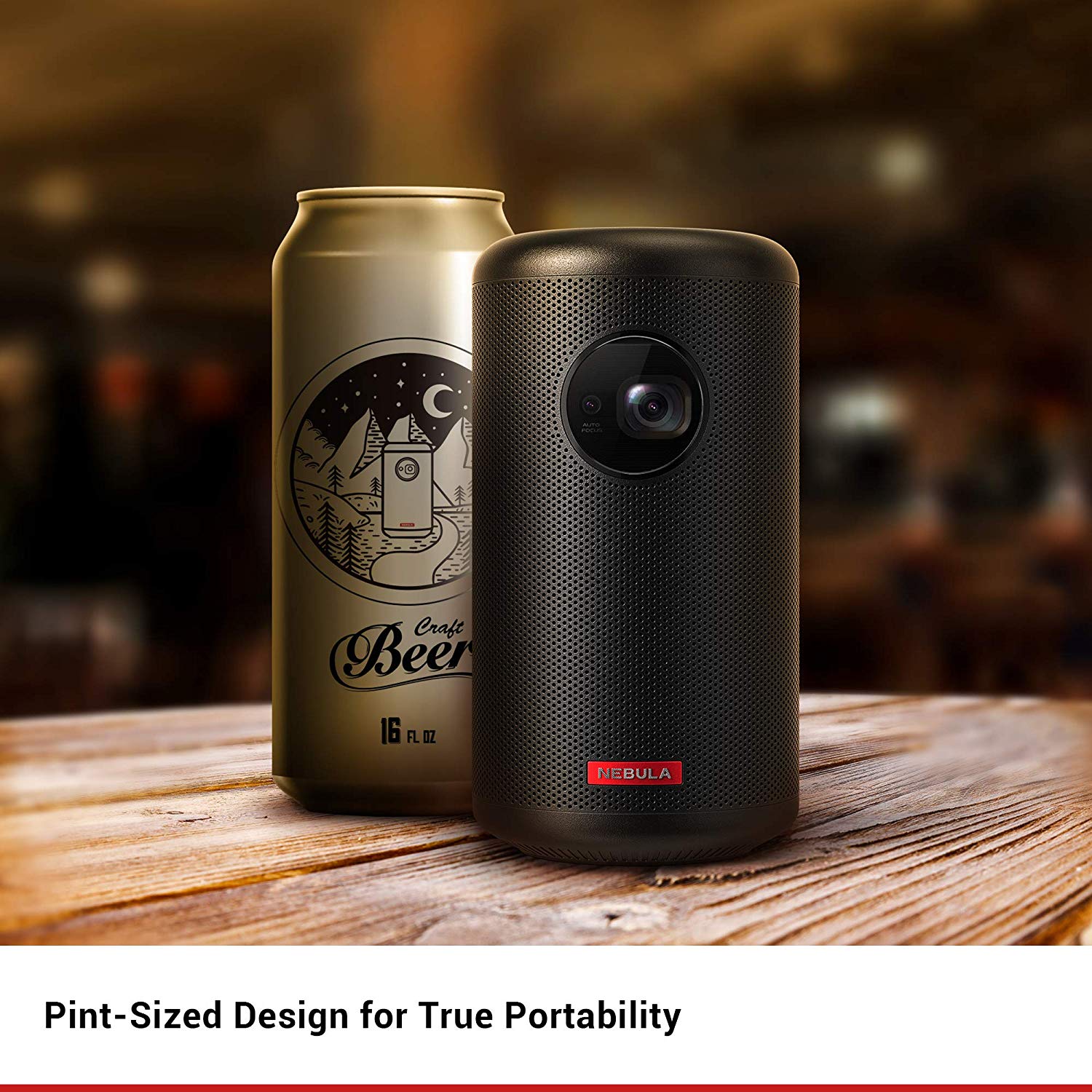 A Nebula Capsule 2 next to a beer can that is roughly the same size.