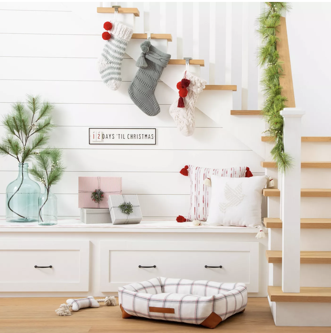 Classic Christmas stockings hanging on a staircase.