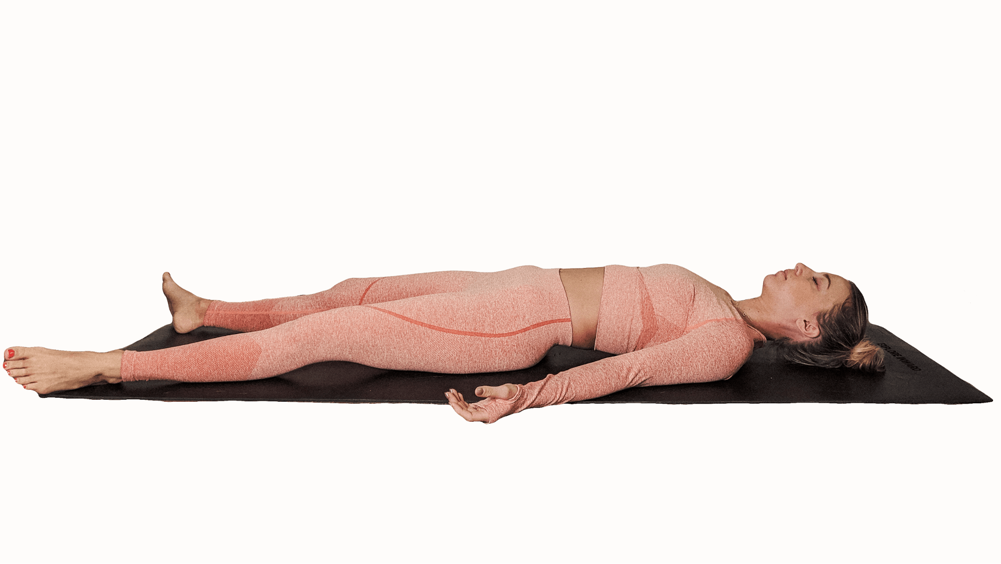 SAVASANA. Lie on your back. Resting your arms comfortably by your sides.