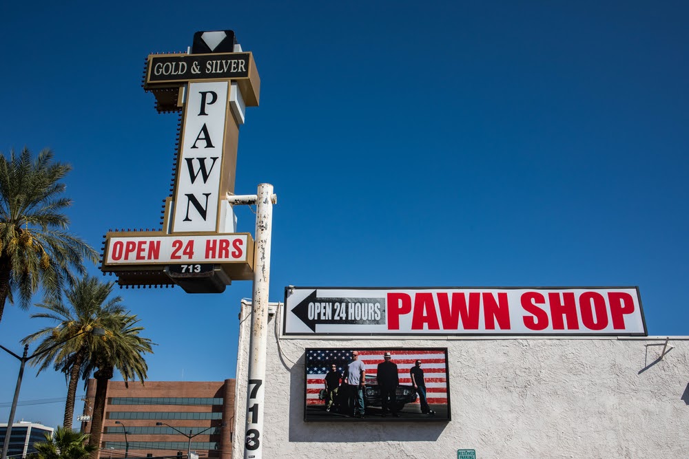 Pawn shop signage on a blue sky
