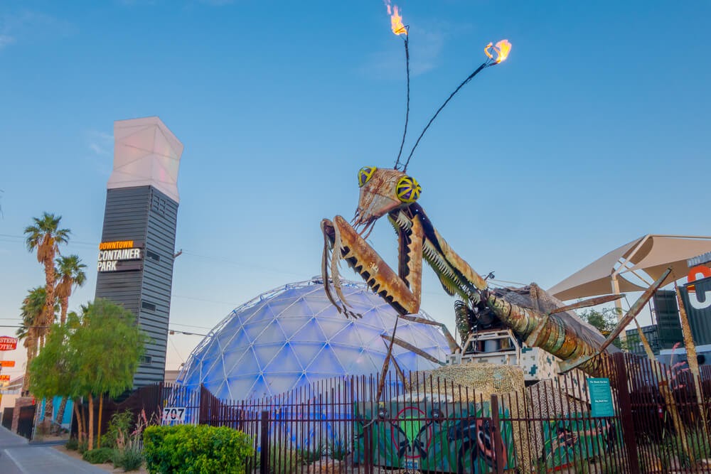 Metal praying mantis sculpture