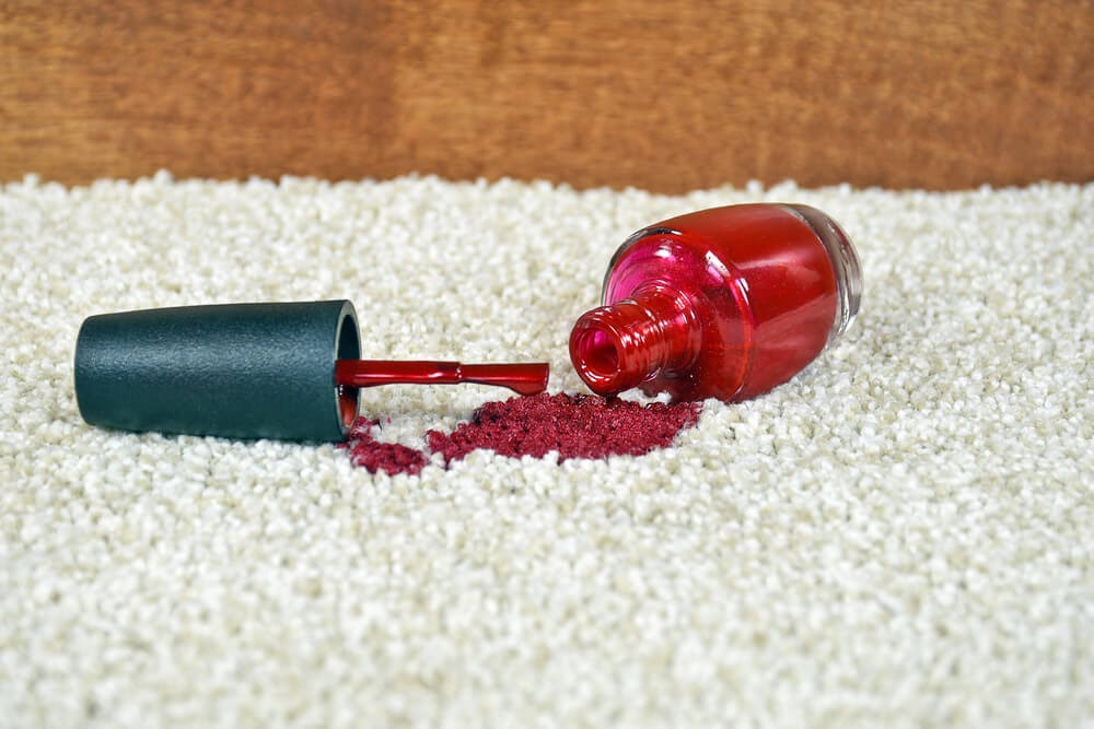 red nail polish on light carpet