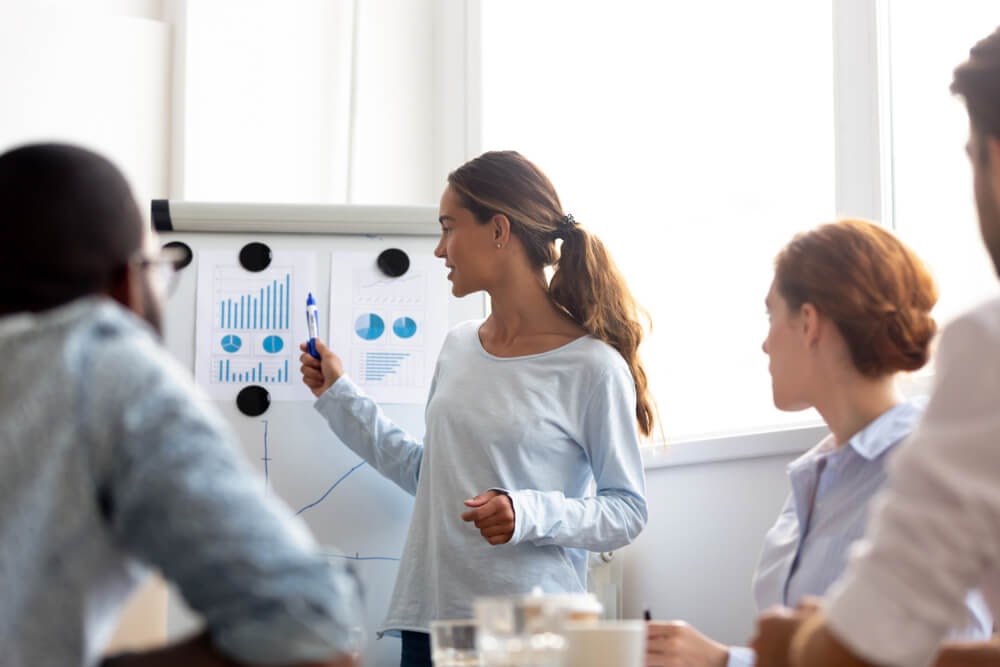 Woman giving presentation to group