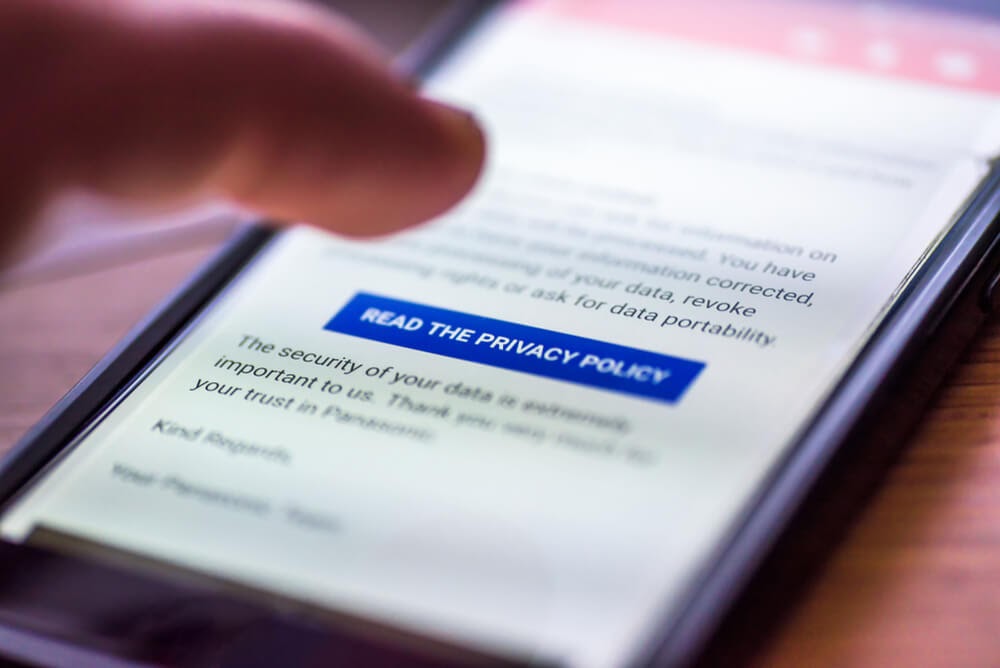 Photo of a cell phone screen displaying "Read The Privacy Policy"
